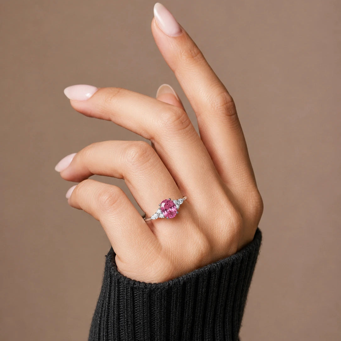 Oval Cut Pink Sapphire Ring with Marquise and Round Diamond Accents