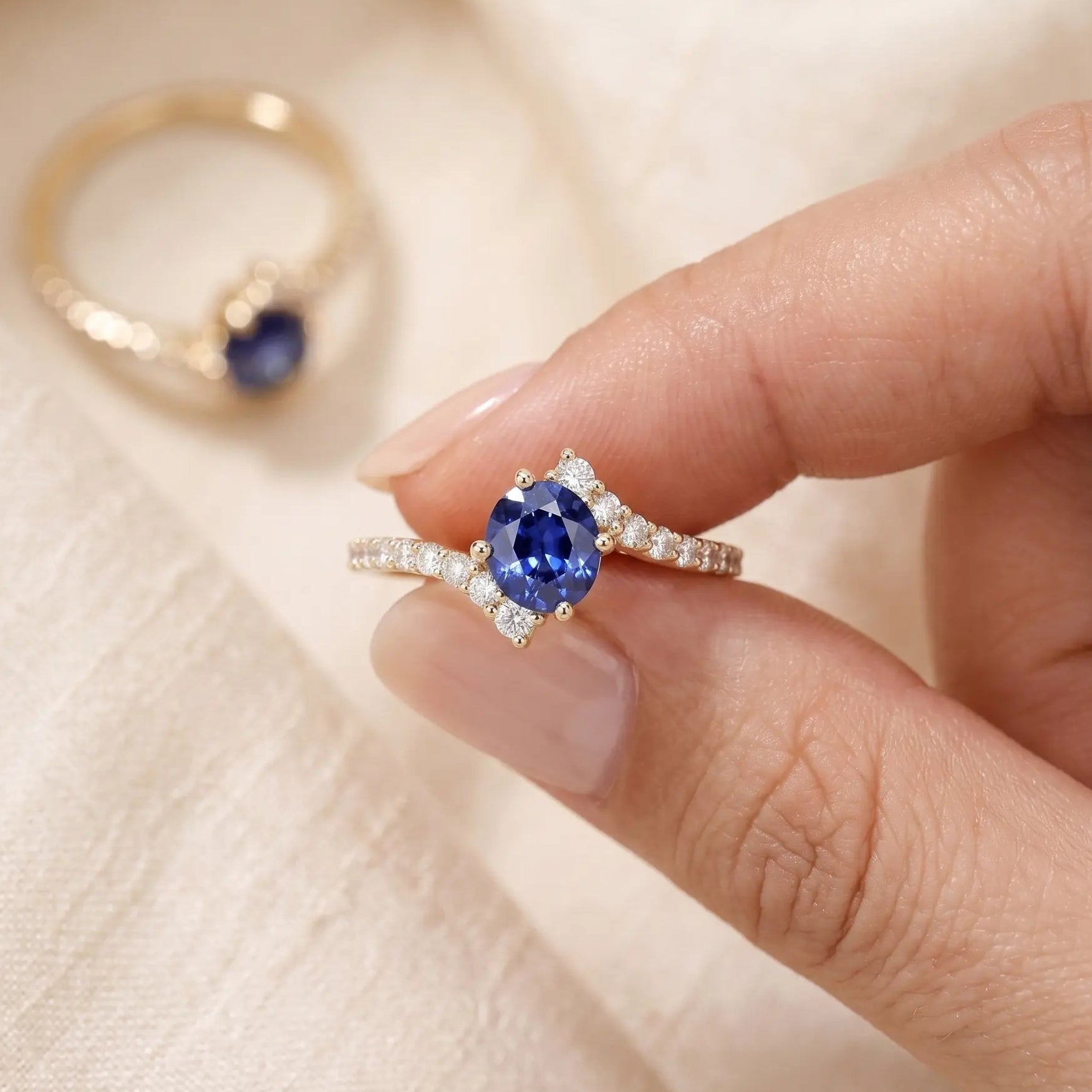 Oval Blue Sapphire Engagement Ring with Diamond Cluster Accents