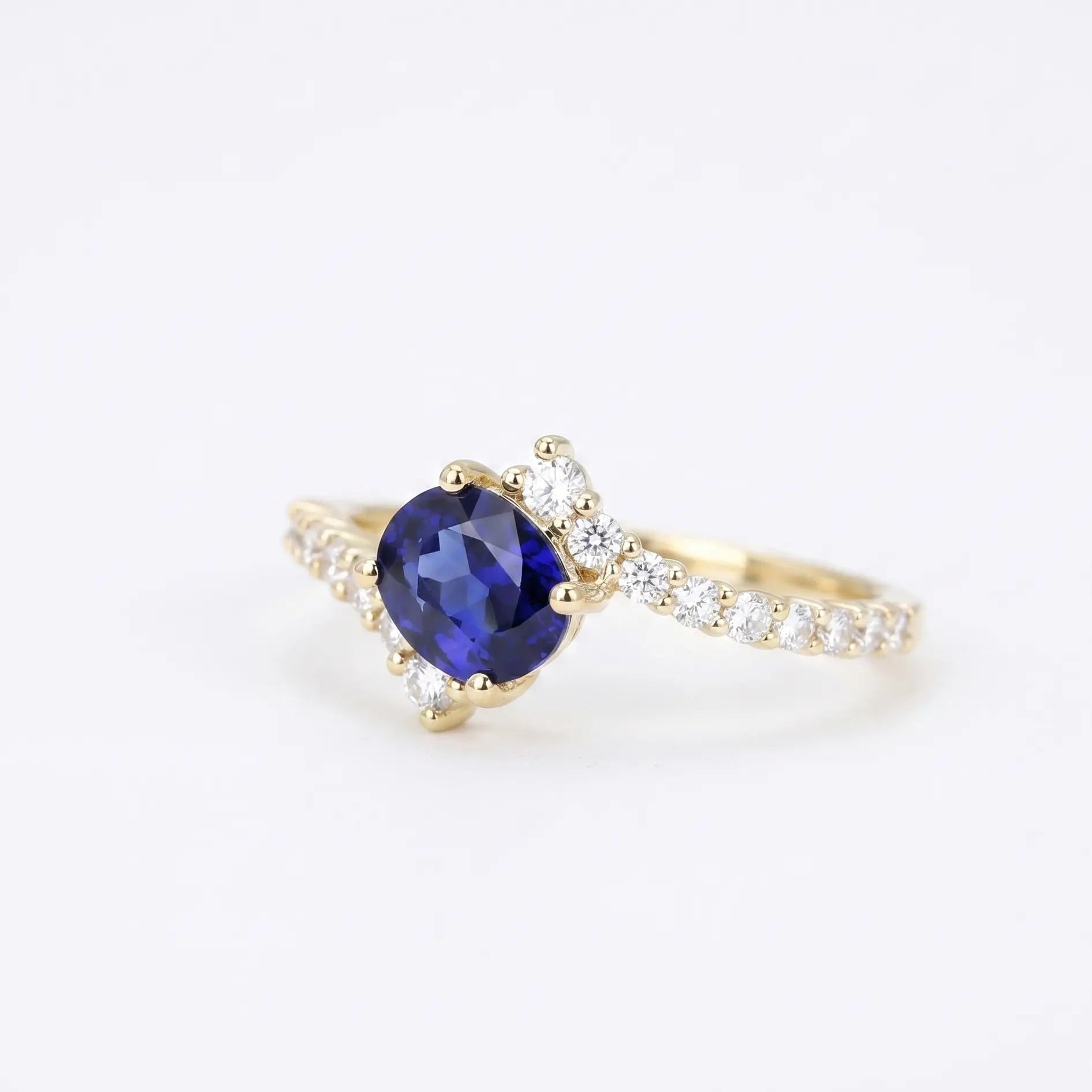 Oval Blue Sapphire Engagement Ring with Diamond Cluster Accents