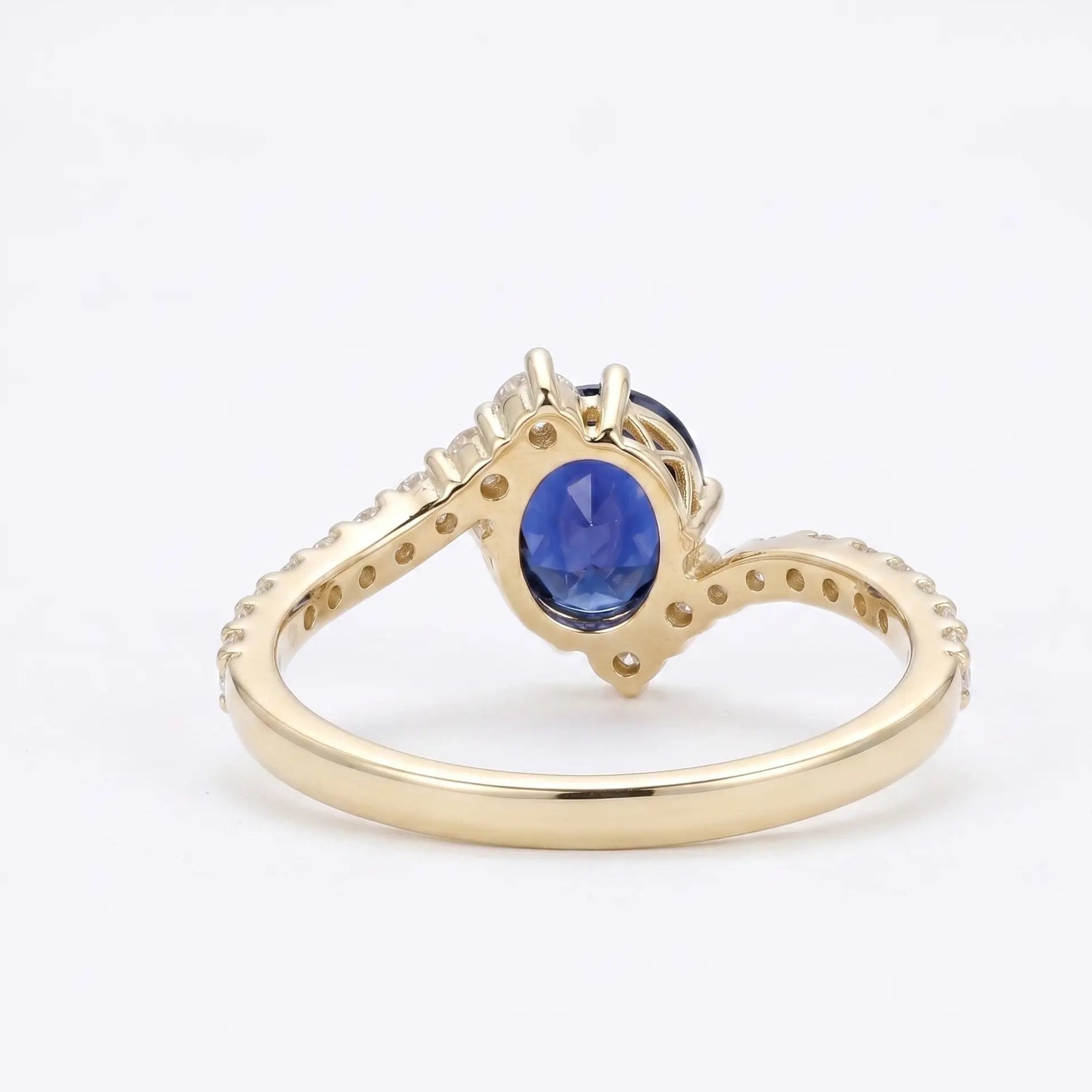 Oval Blue Sapphire Engagement Ring with Diamond Cluster Accents