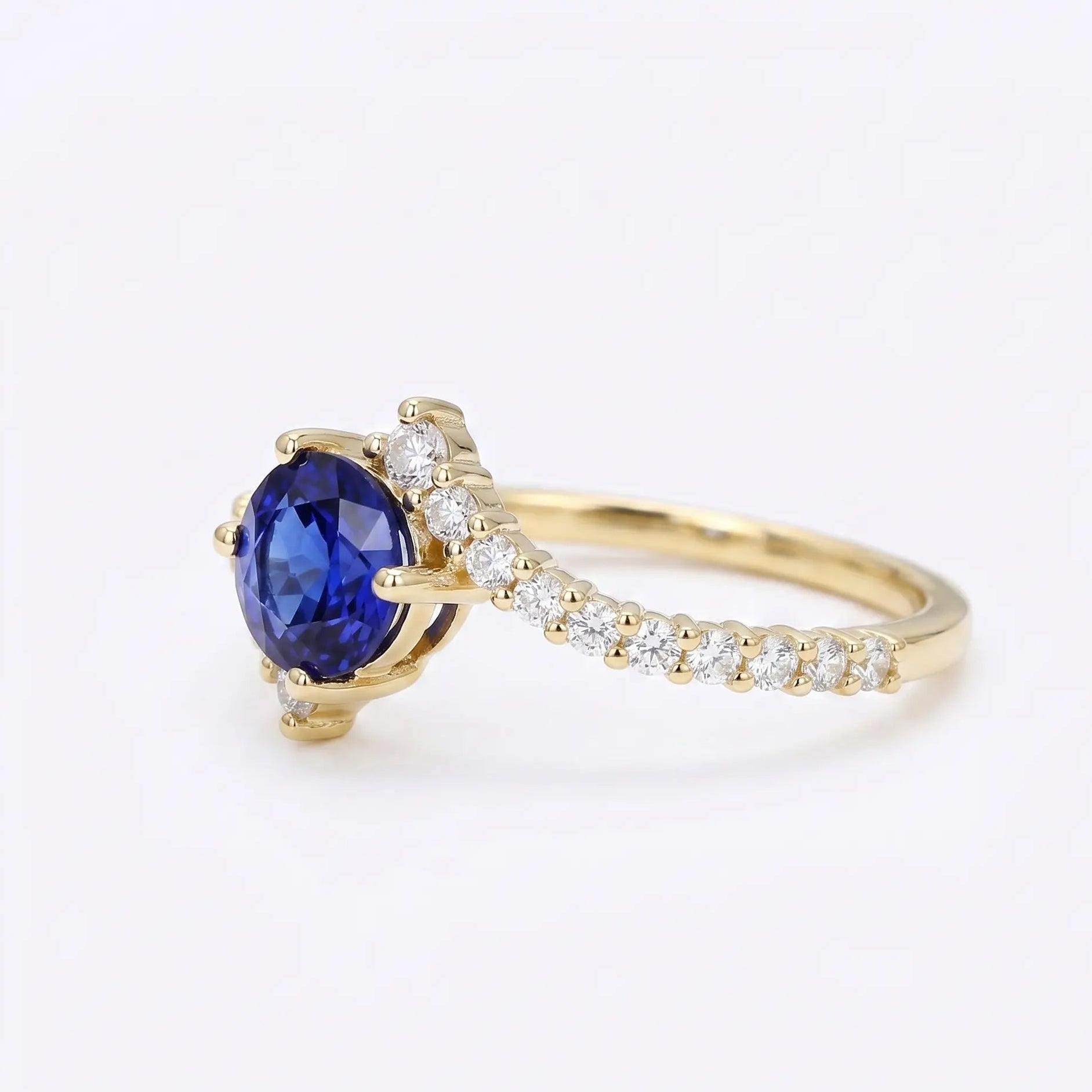 Oval Blue Sapphire Engagement Ring with Diamond Cluster Accents