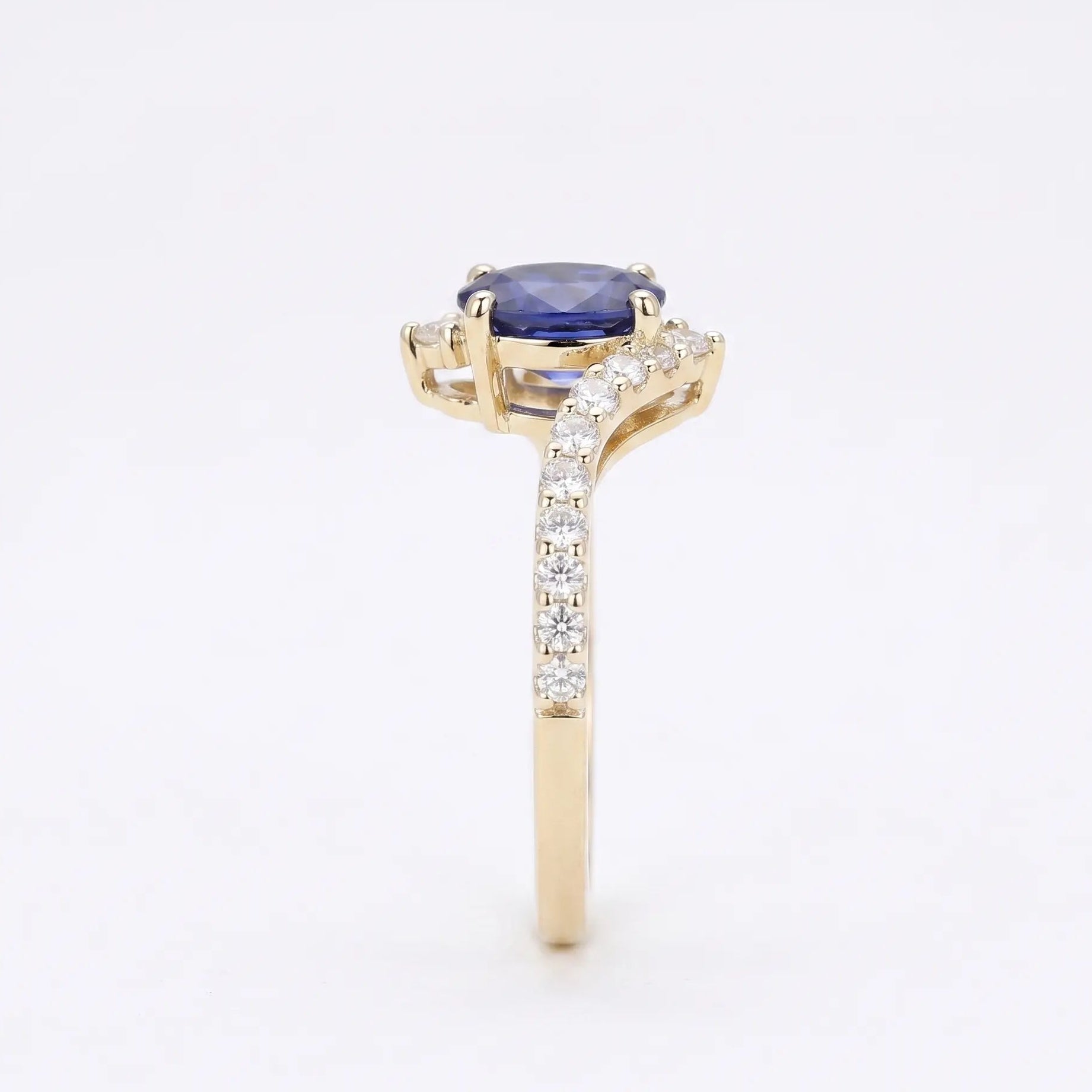 Oval Blue Sapphire Engagement Ring with Diamond Cluster Accents