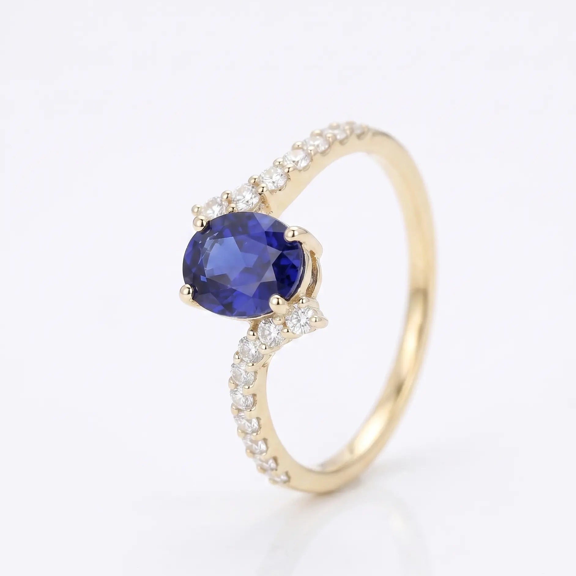 Oval Blue Sapphire Engagement Ring with Diamond Cluster Accents