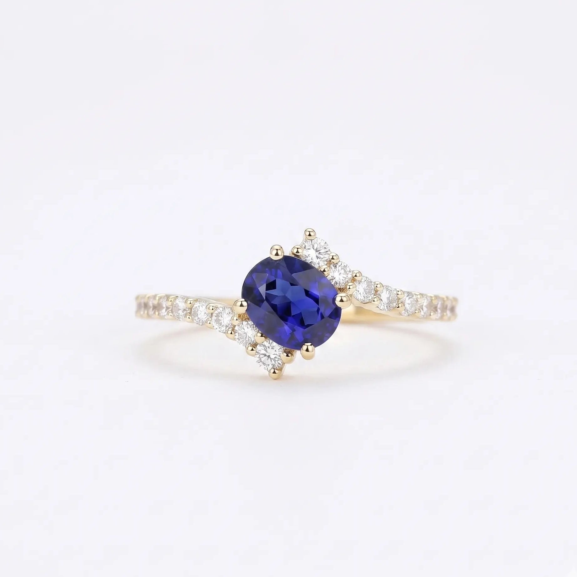 Oval Blue Sapphire Engagement Ring with Diamond Cluster Accents