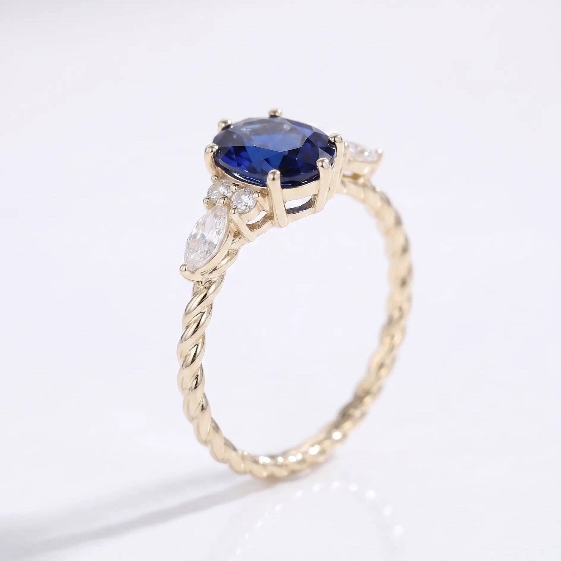 Oval Cut Blue Sapphire Ring with Marquise and Round Diamond Side Stones