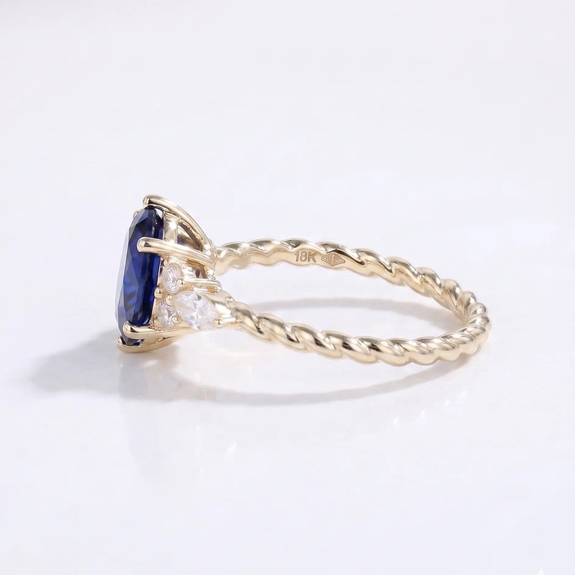 Oval Cut Blue Sapphire Ring with Marquise and Round Diamond Side Stones