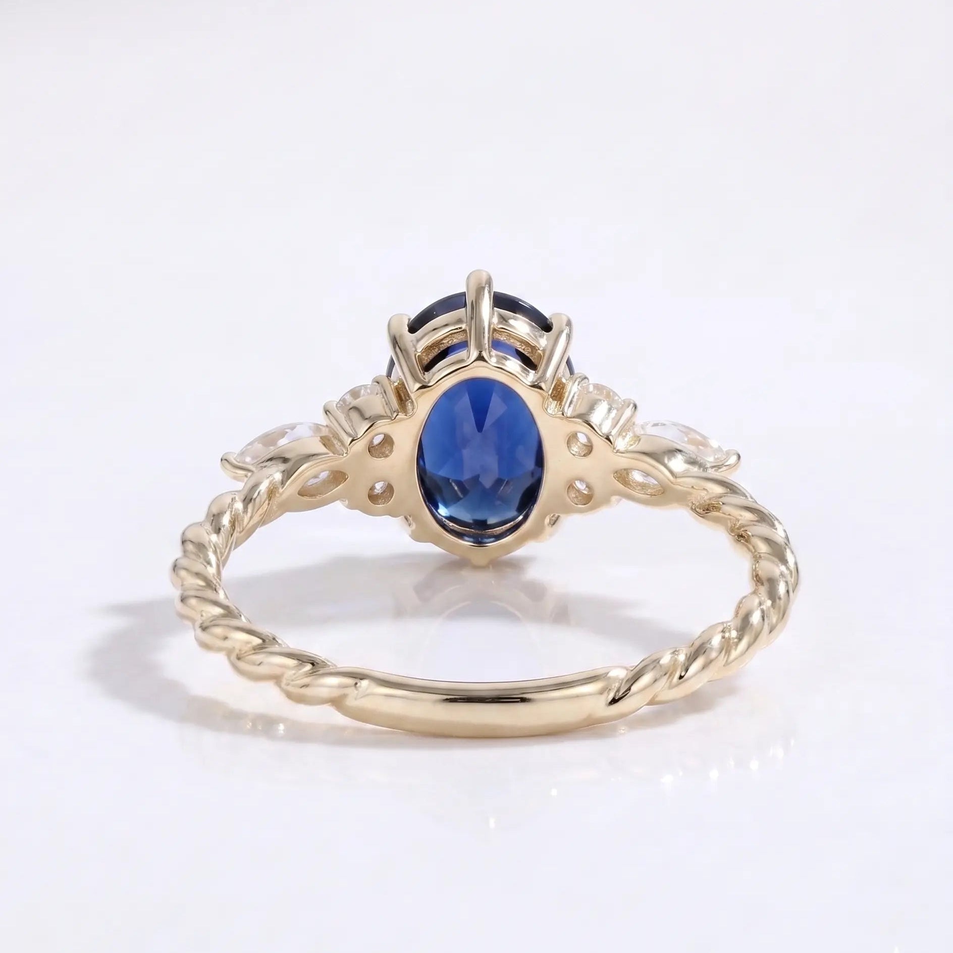Oval Cut Blue Sapphire Ring with Marquise and Round Diamond Side Stones