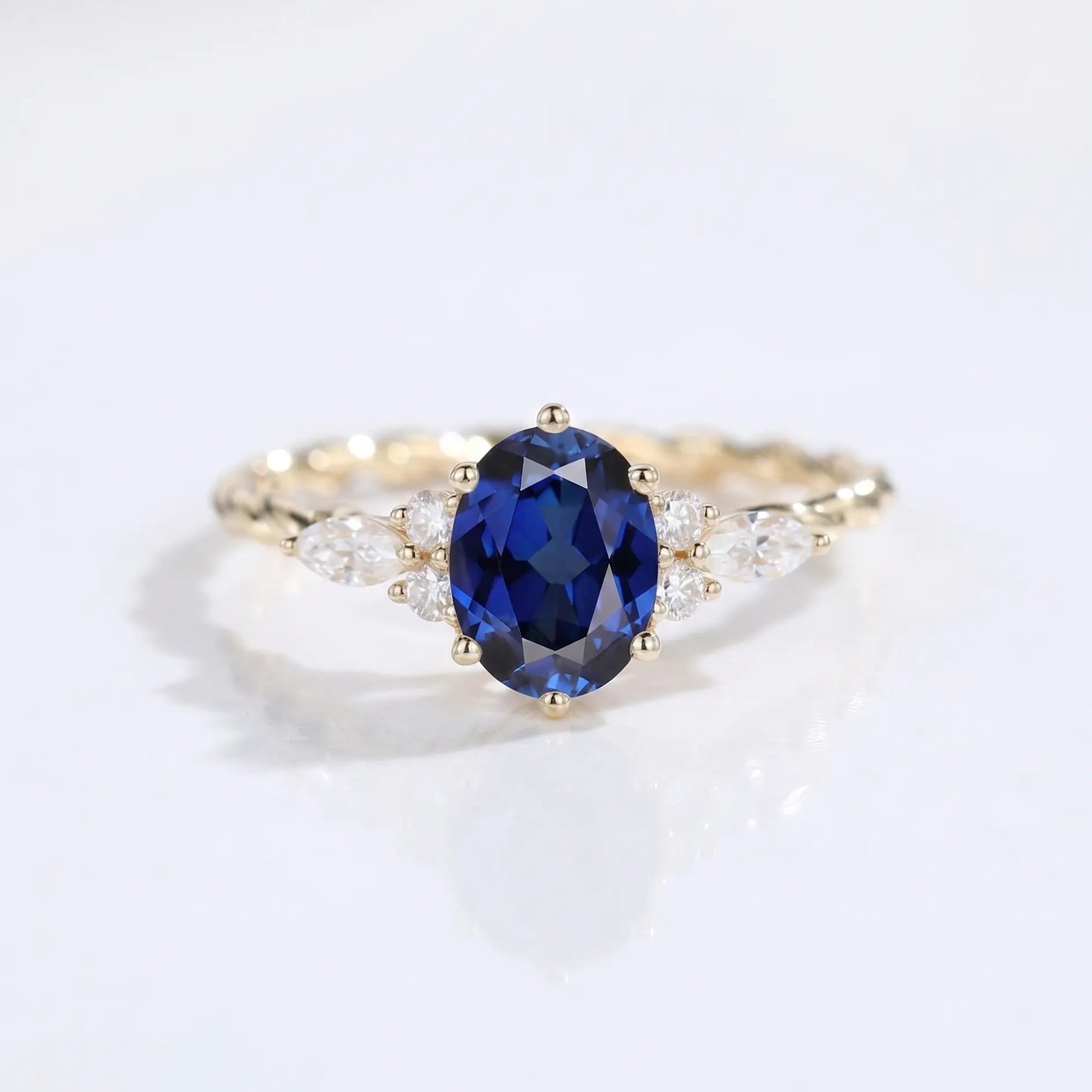 Oval Cut Blue Sapphire Ring with Marquise and Round Diamond Side Stones