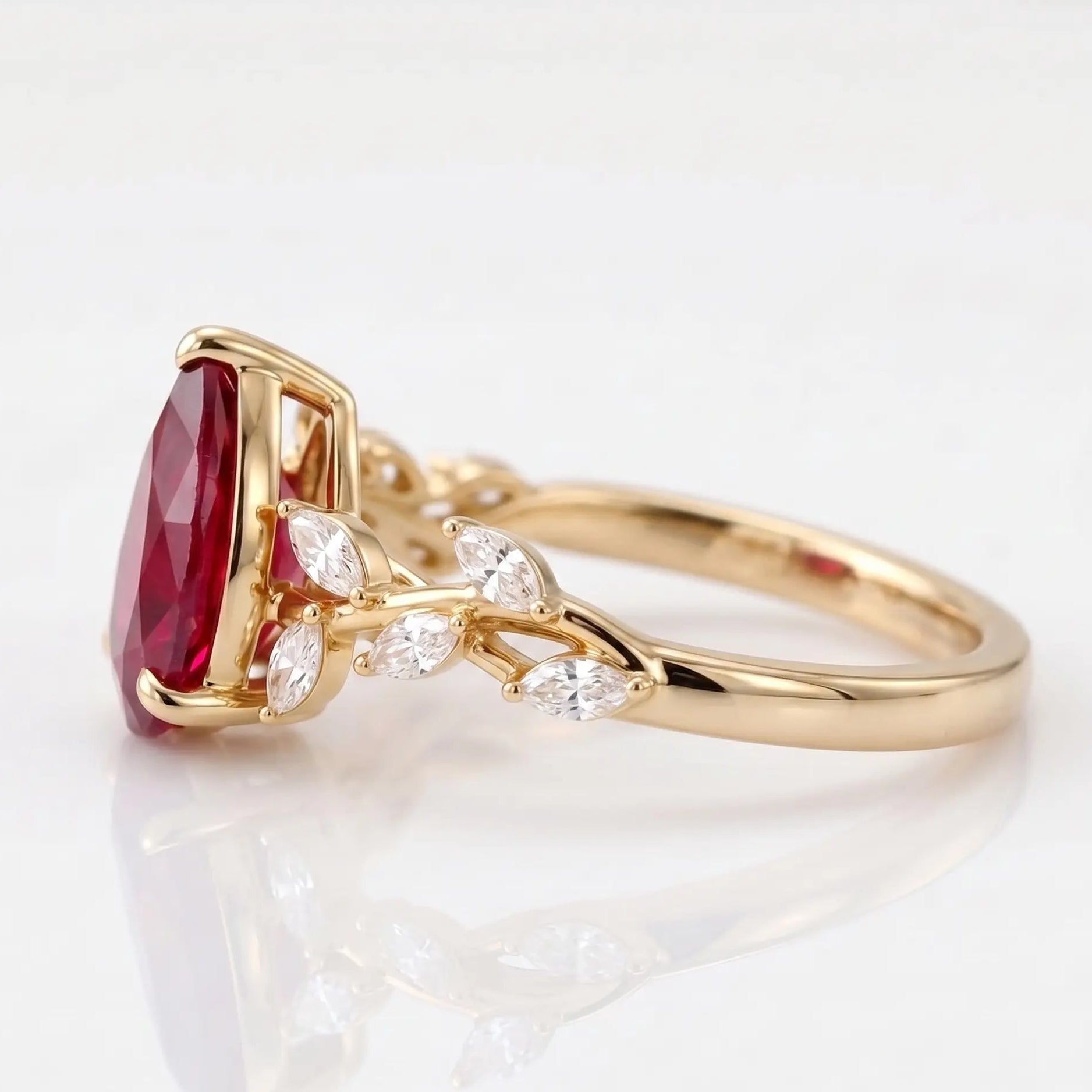Pear Cut Red Ruby Nature Inspired Engagement Ring with Leaf Accents